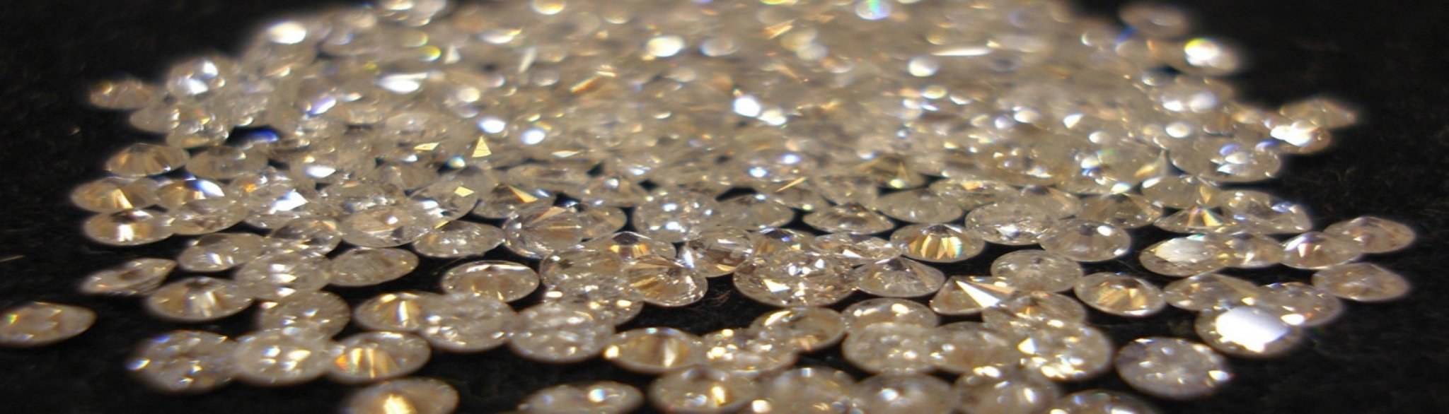 Scattered brilliant-cut diamonds representing precious stone storage